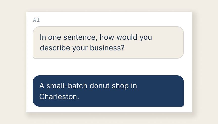 Chat example: Claude asks how you'd describe your business in one sentence, and the reply is 'A small-batch donut shop in Charleston.'